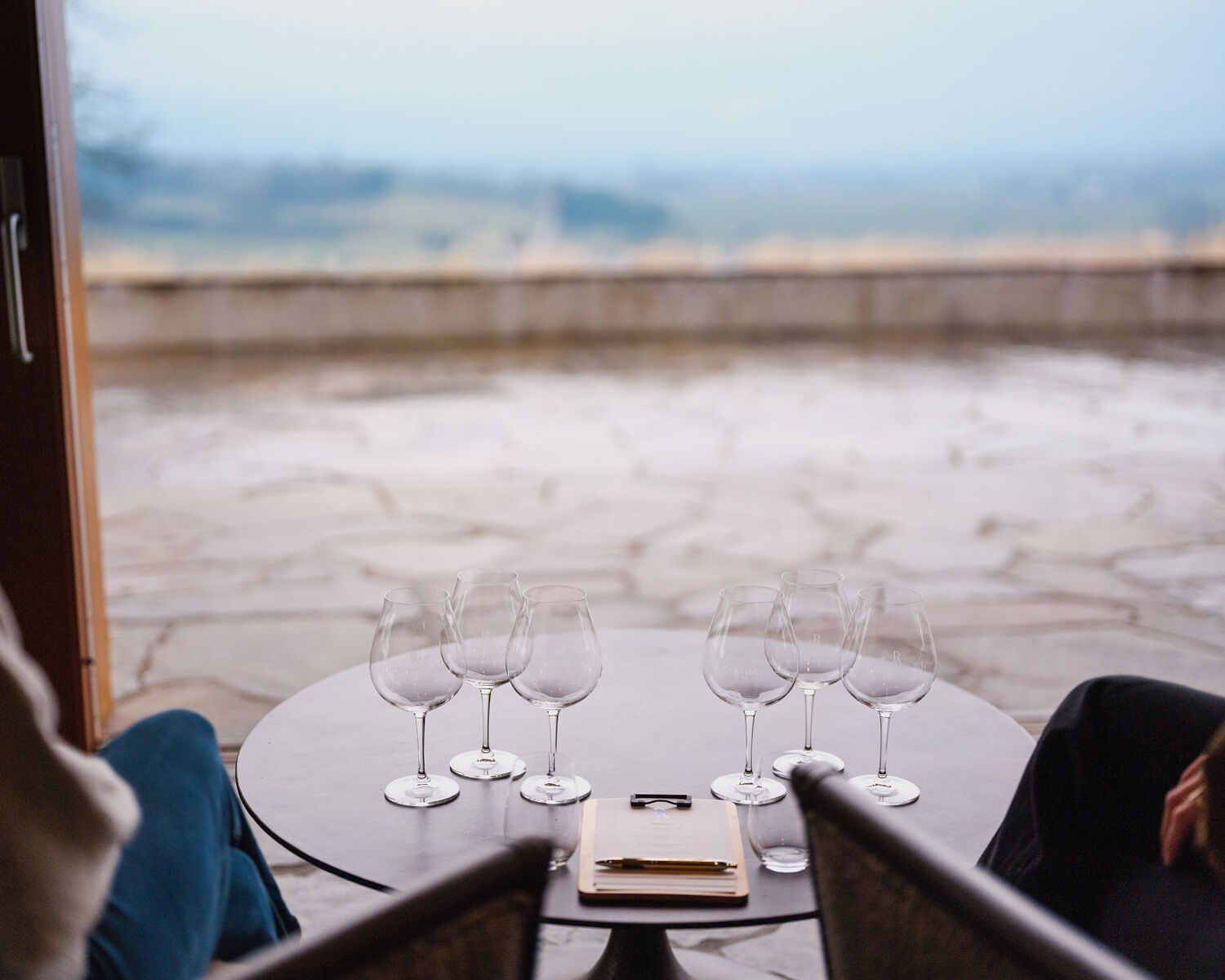 6 glasses overlooking the view at Penner-Ash Wine Cellars. 6 glasses overlooking the view at Penner-Ash Wine Cellars.